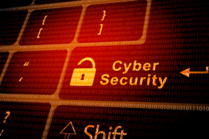 Cybersecurity concept with a glowing padlock icon and the words "Cyber Security" on a red-lit keyboard overlaid with binary code.