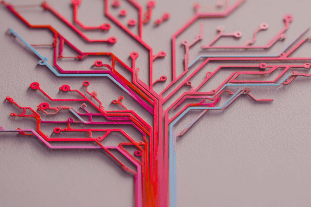 Abstract image of a circuit board shaped like a branching tree in red and pink tones, symbolizing technology and growth.