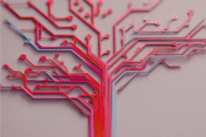 Abstract image of a circuit board shaped like a branching tree in red and pink tones, symbolizing technology and growth.